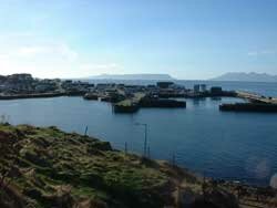 Mallaig harbour with the islands of Eigg and Rum in the background 